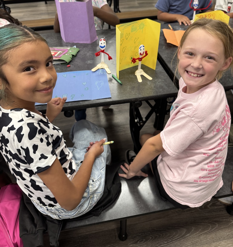 students using "trash" items to create toys