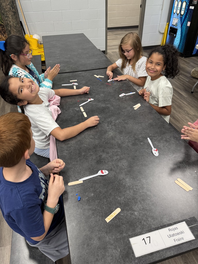 students using "trash" items to create toys