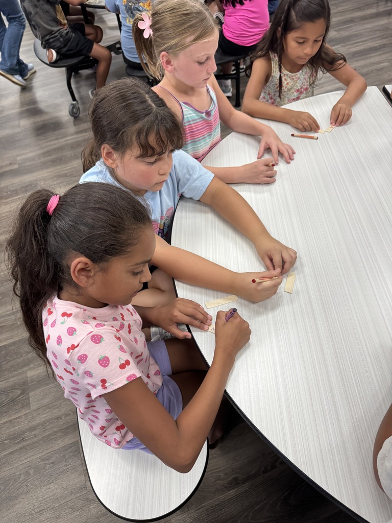 students using "trash" items to create toys