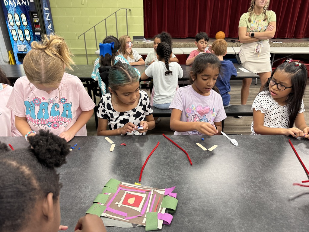 students using "trash" items to create toys