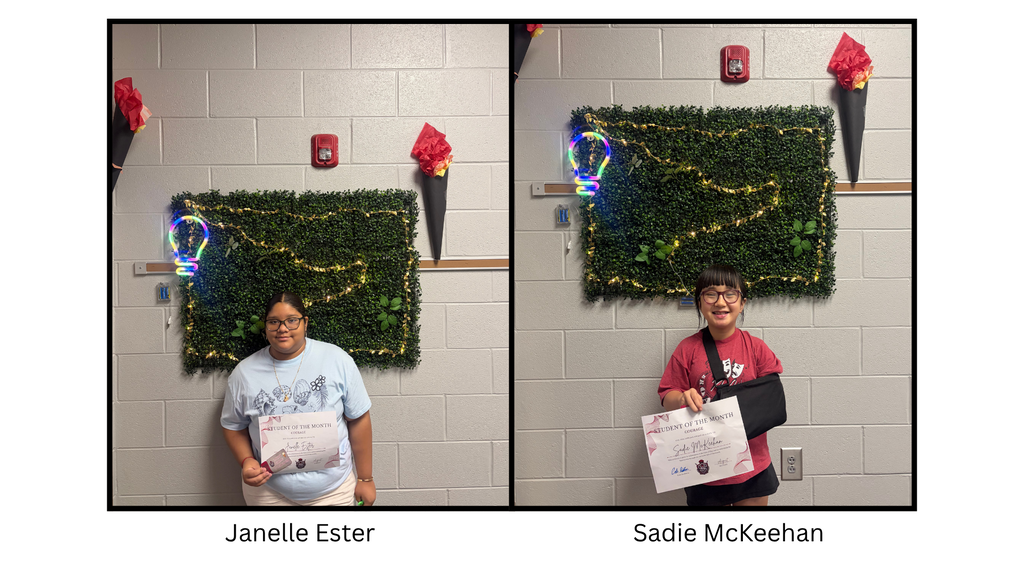 Janelle Ester and Sadie McKeehan holding a Spartan Student of the Month certificate. The student is being recognized by the 7th Grade 600 Hallway Spartans for demonstrating the character trait of courage.