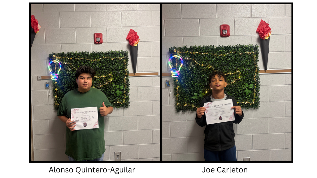 Alonso Quintero-Aguilar and Joe Carleton holding a Spartan Student of the Month certificate. The student is being recognized by the 7th Grade 600 Hallway Spartans for demonstrating the character trait of courage.
