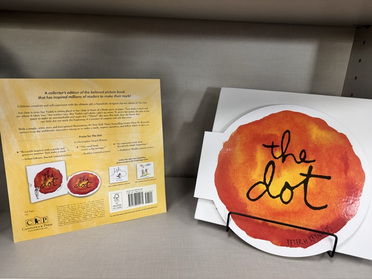 special collector’s edition of The Dot by Peter H. Reynolds displayed on a library shelf.
