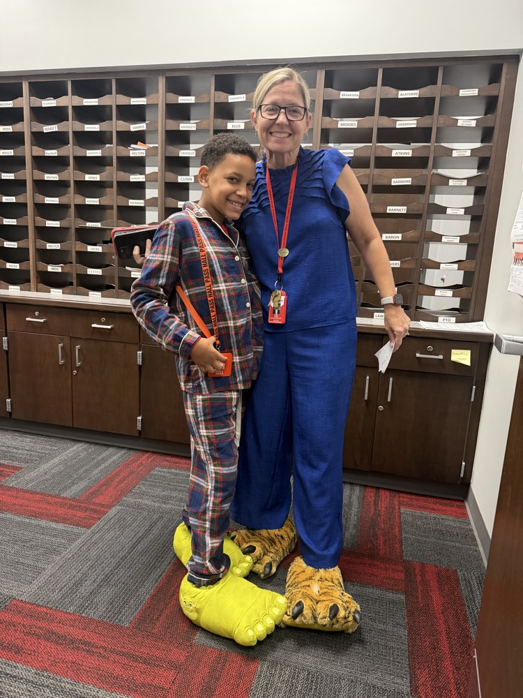 Two participants wearing pajamas for HCMS Pajama Day during Homecoming Spirit Week. The photo highlights participation in the school's spirit week activities.