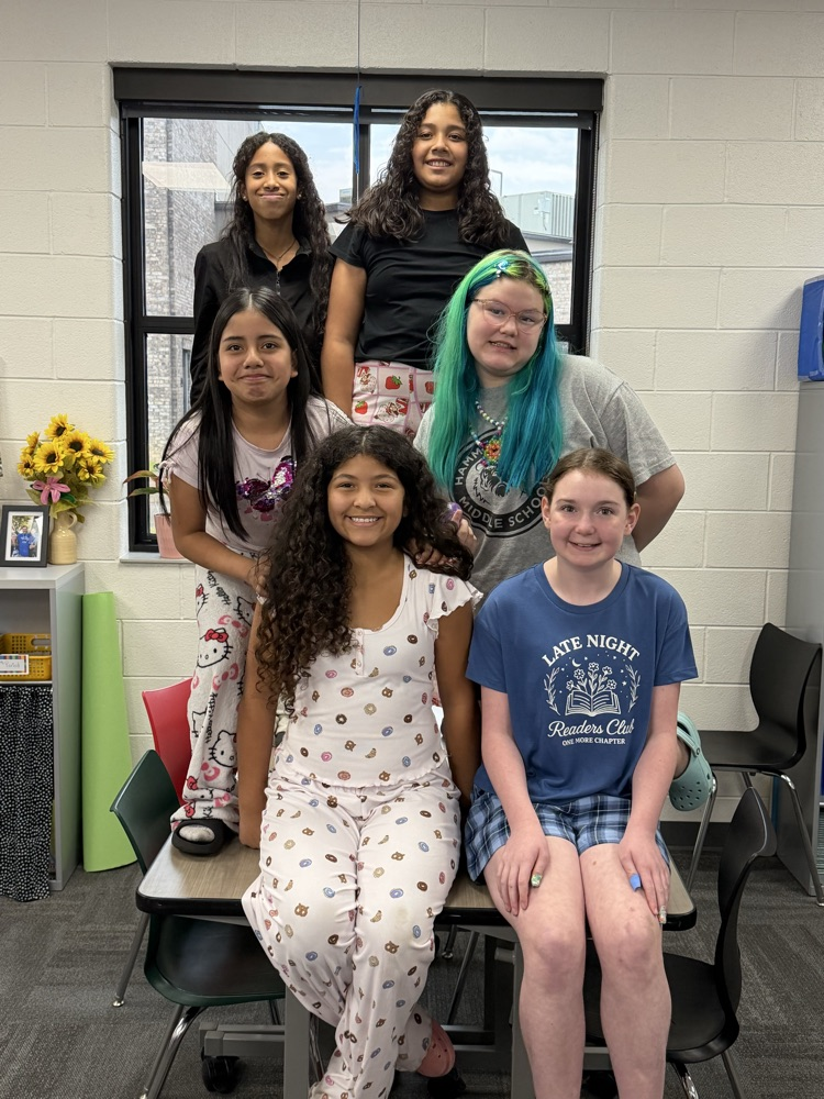 Large group of students and/or staff wearing pajamas for HCMS Pajama Day. The group is participating in Homecoming Spirit Week and posing together to celebrate school spirit and the start of the week's activities.