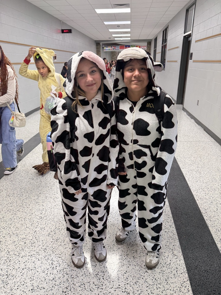 Two participants wearing pajamas for HCMS Pajama Day during Homecoming Spirit Week. The photo highlights participation in the school's spirit week activities.