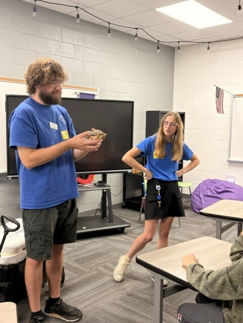 Tennessee Aquarium presenter holds a small turtle during a science classroom visit at HCMS. The presentation gave students an opportunity to learn about wildlife through hands-on experiences with live animals.