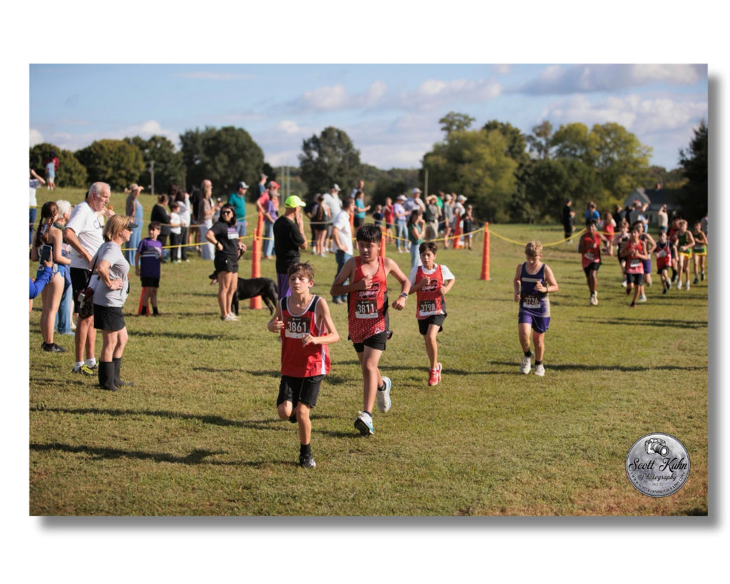 Boys cross country runners racing.