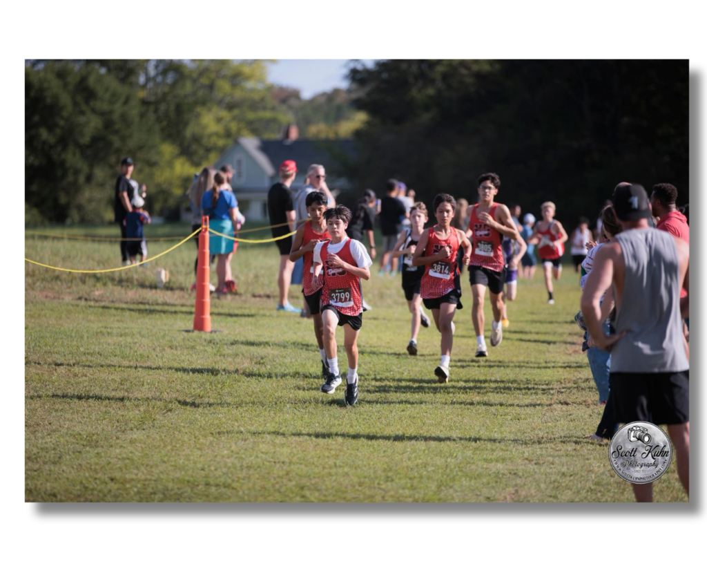 Boys cross country runners racing.