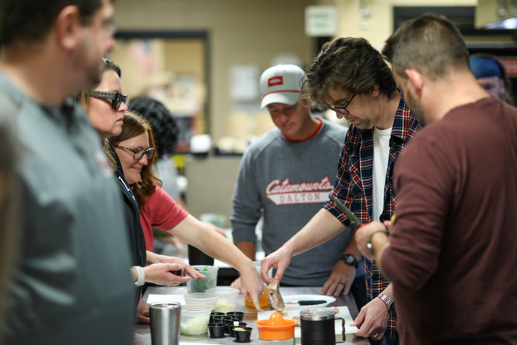 A culinary class cooking.