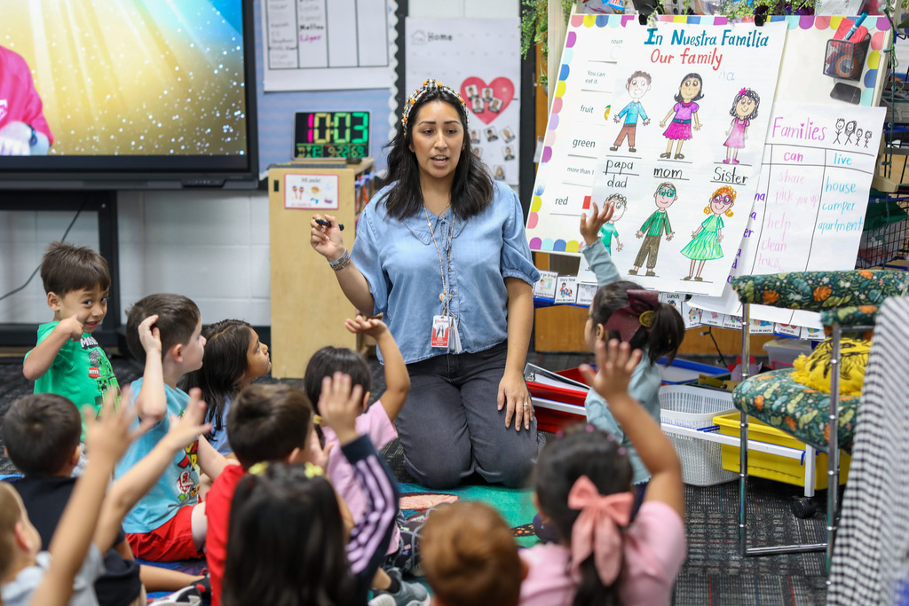 A teacher talks to her class.