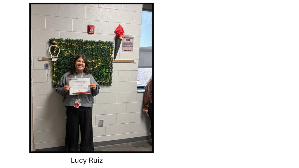 Lucy Ruiz holds a Spartan Teacher of the Month certificate. The recognition celebrates demonstrating the September character trait of Hope.