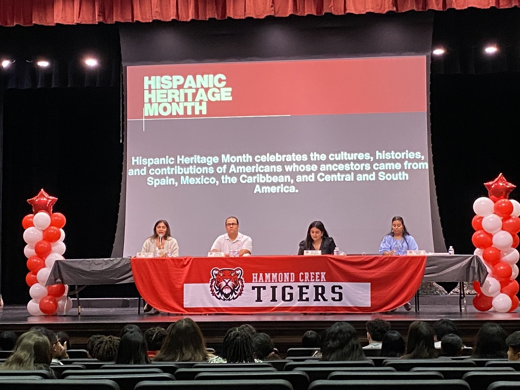 Panelists participate in a Hispanic Heritage Month discussion for HCMS students. Community members share stories, experiences, and perspectives during a presentation hosted by 6th grade social studies.