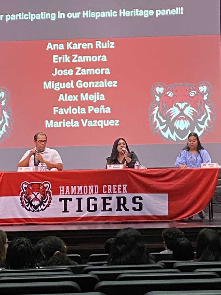 Panelists participate in a Hispanic Heritage Month discussion for HCMS students. Community members share stories, experiences, and perspectives during a presentation hosted by 6th grade social studies.