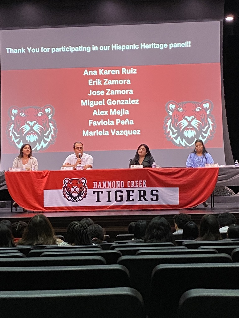 Panelists participate in a Hispanic Heritage Month discussion for HCMS students. Community members share stories, experiences, and perspectives during a presentation hosted by 6th grade social studies.