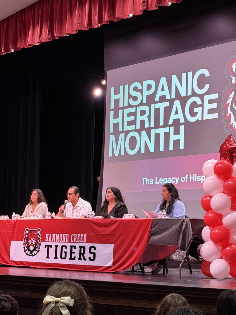 Panelists participate in a Hispanic Heritage Month discussion for HCMS students. Community members share stories, experiences, and perspectives during a presentation hosted by 6th grade social studies.