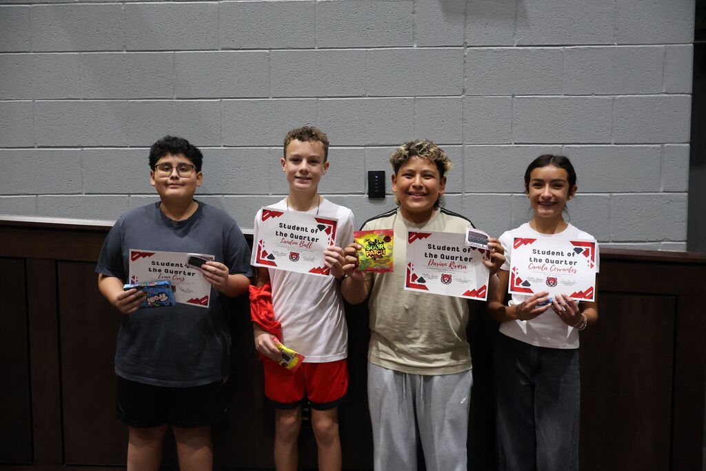 Group photo of HCMS seventh-grade Students of the Quarter and Connections Students of the Quarter holding their certificates.
