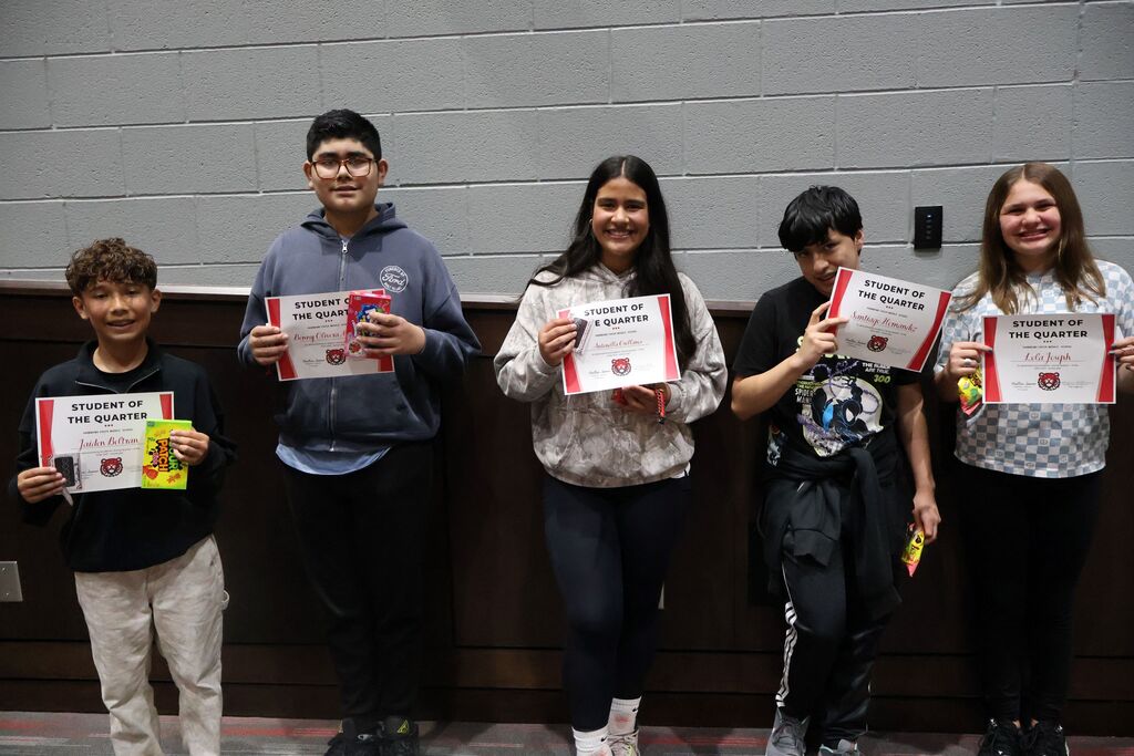 Group photo of HCMS seventh-grade Students of the Quarter and Connections Students of the Quarter holding their certificates.