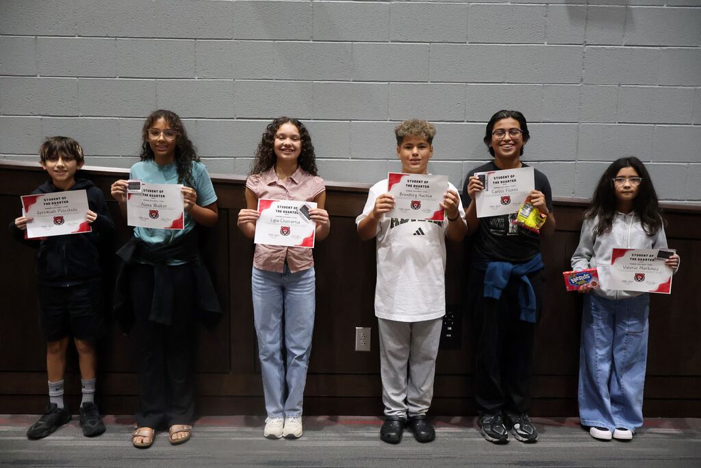Group photo of HCMS sixth-grade Students of the Quarter and Connections Students of the Quarter holding their certificates.