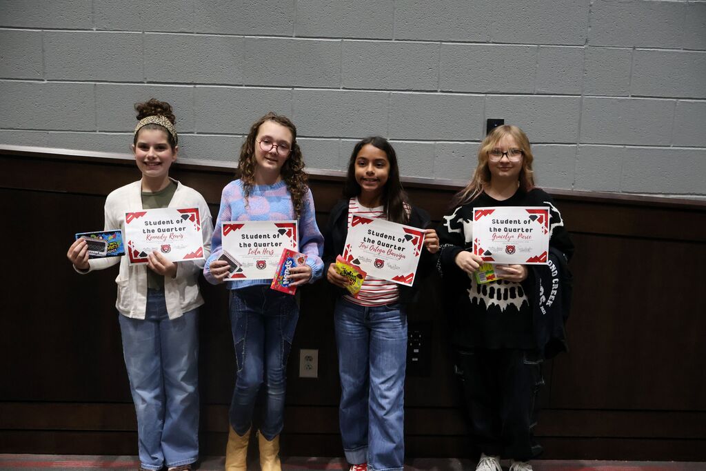 Group photo of HCMS sixth-grade Students of the Quarter and Connections Students of the Quarter holding their certificates.