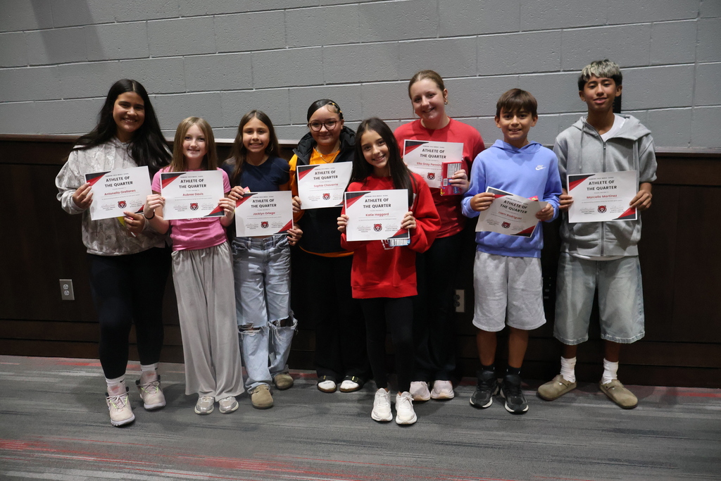 Group photo of HCMS seventh-grade Athletes of the Quarter holding their certificates.
