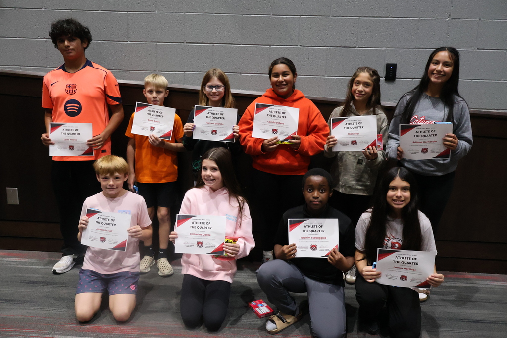 Group photo of HCMS sixth-grade Athletes of the Quarter holding their certificates.