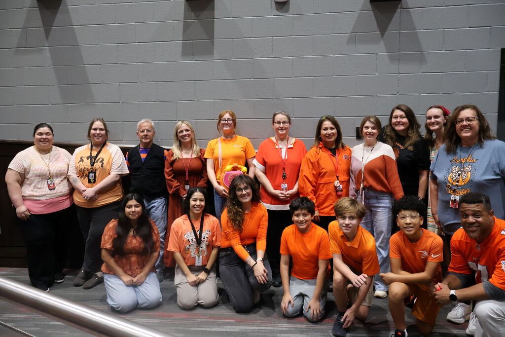 Group photo of HCMS seventh-grade students and teachers wearing orange in recognition of Unity Day.