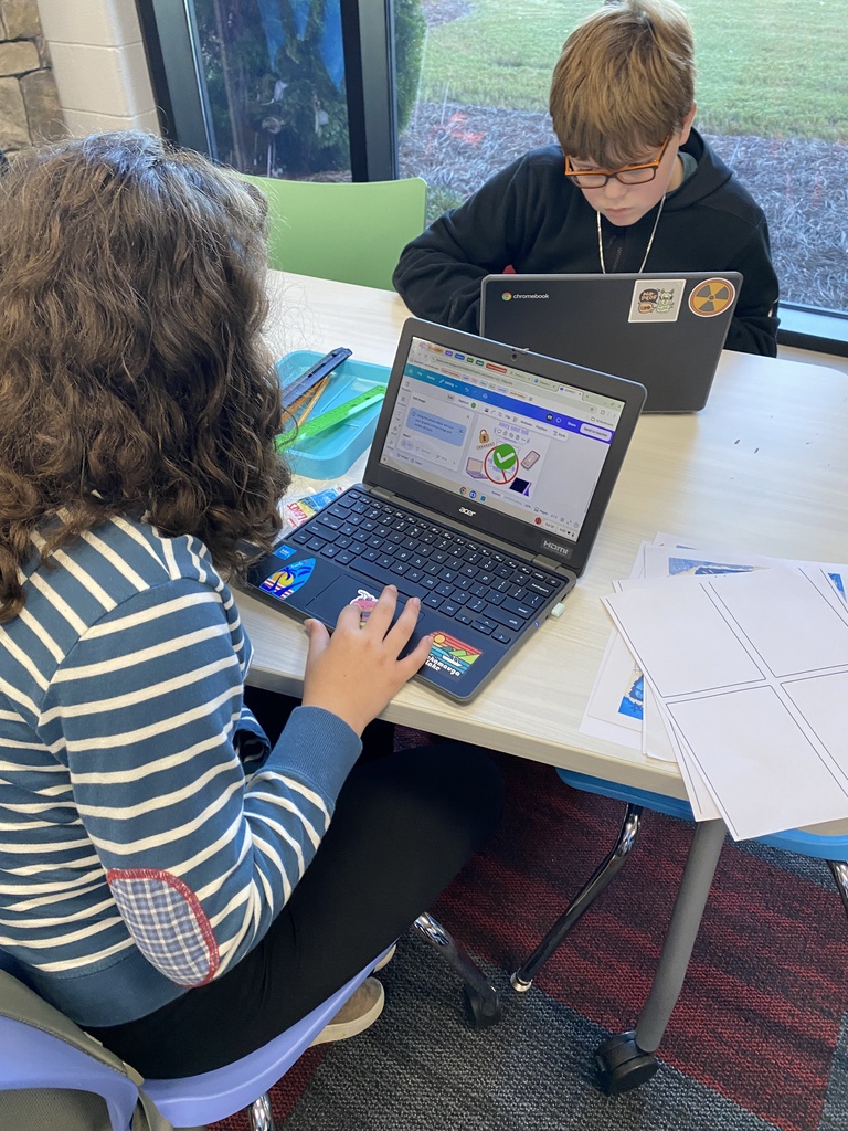HCMS students putting cybersecurity knowledge into action through hands-on activities.
