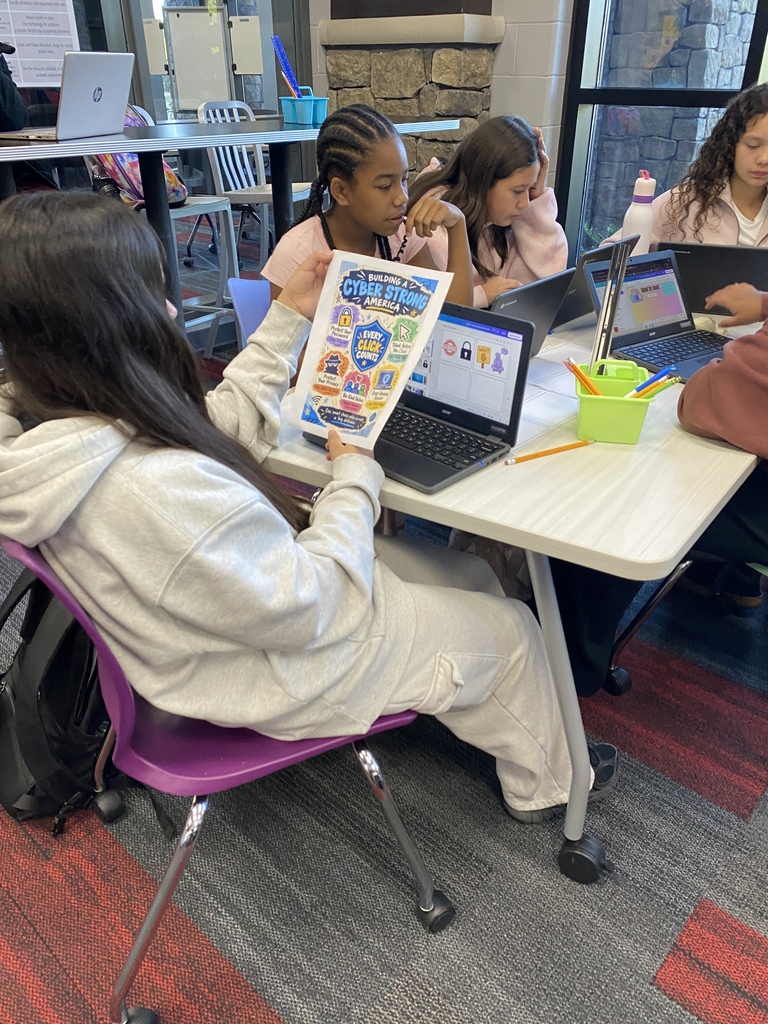 HCMS students putting cybersecurity knowledge into action through hands-on activities.