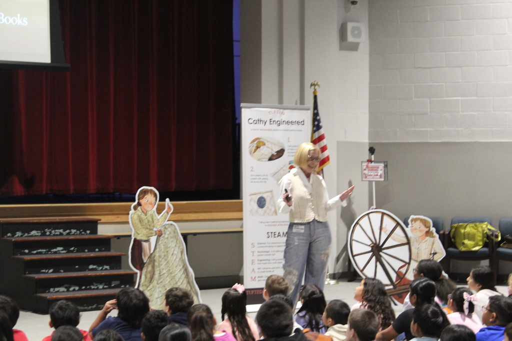 author Rachel Smalley presents in auditorium to students 