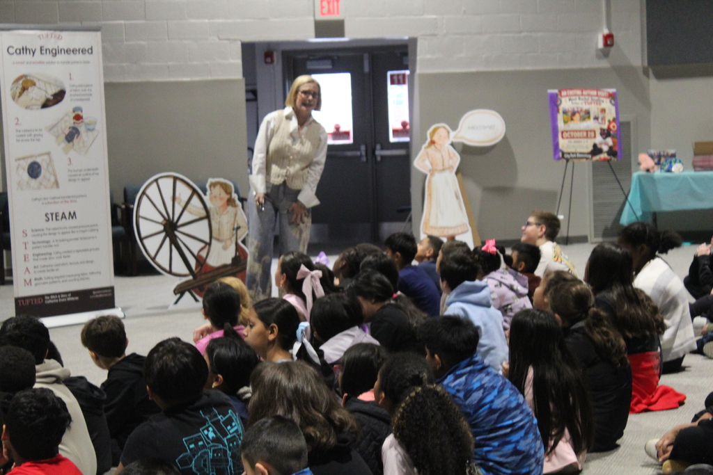 author Rachel Smalley presents in auditorium to students 