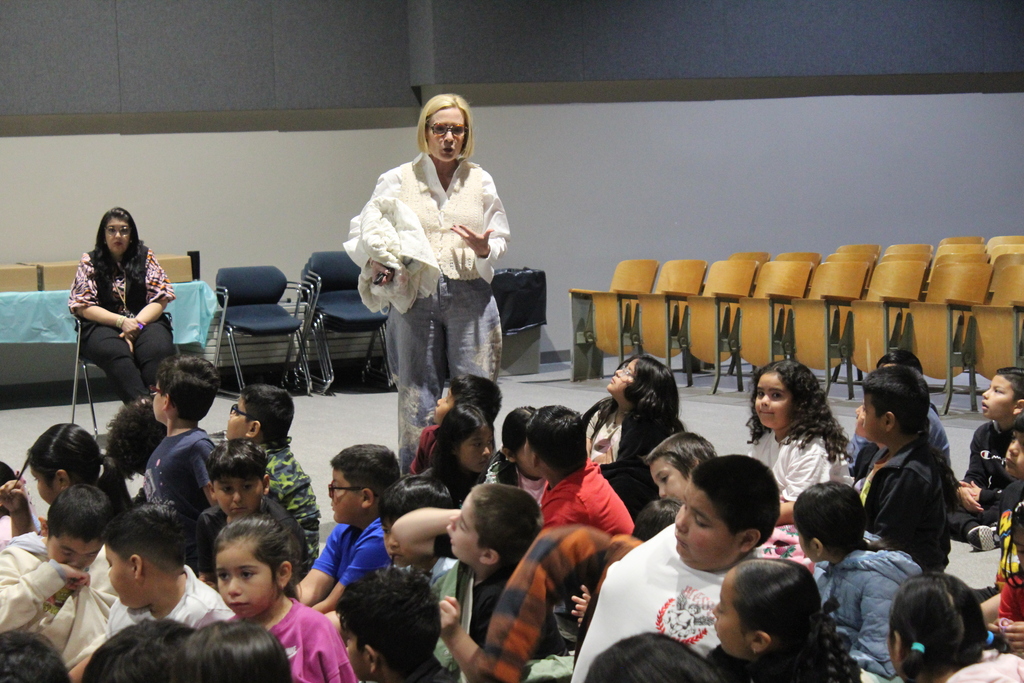 author Rachel Smalley presents in auditorium to students 