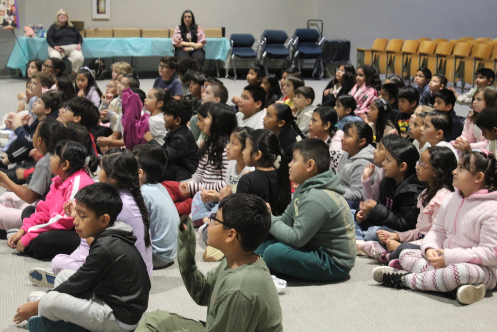 author Rachel Smalley presents in auditorium to students 