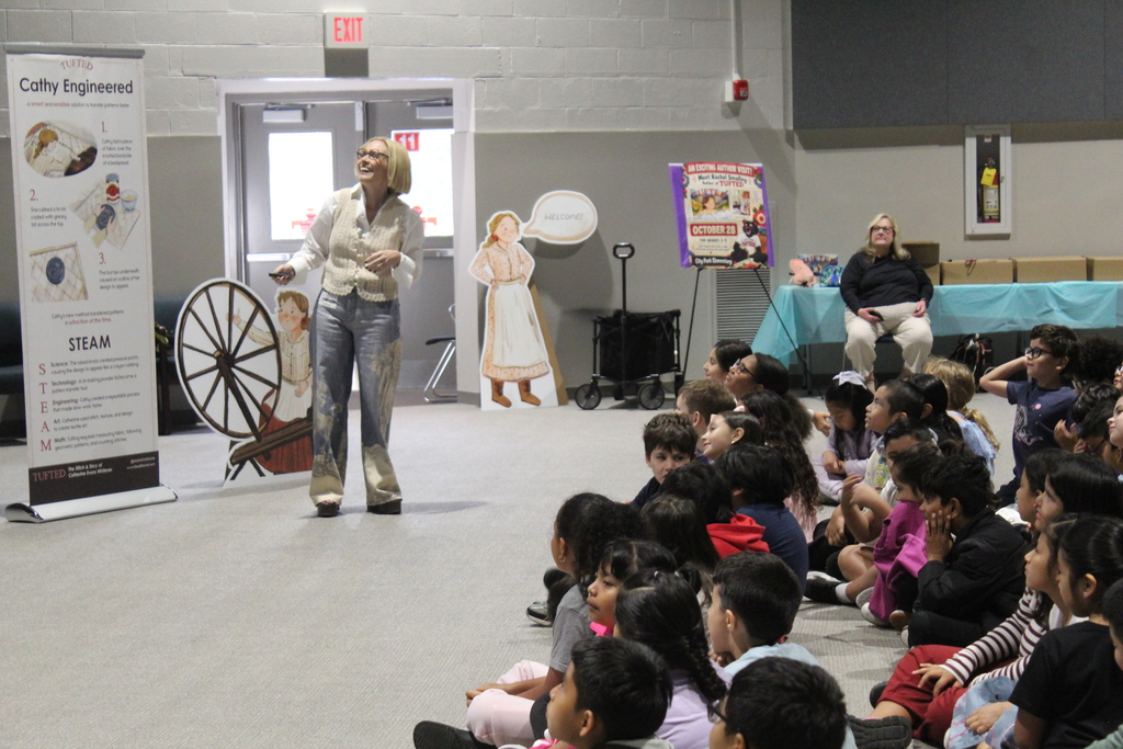 author Rachel Smalley presents in auditorium to students 