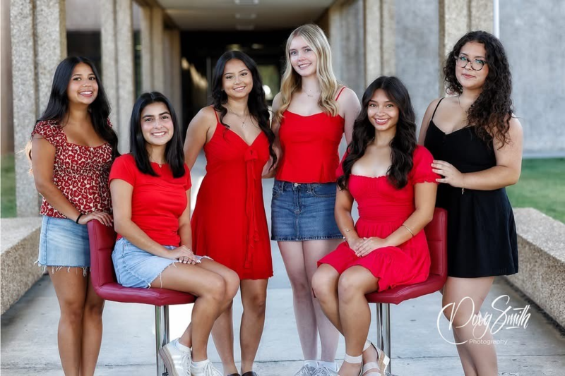 a group of girls smile standing together