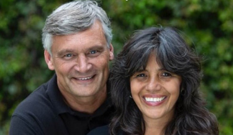 man and woman smiling at the camera