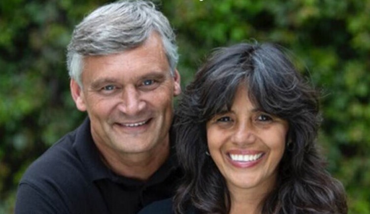 man and woman smiling at the camera