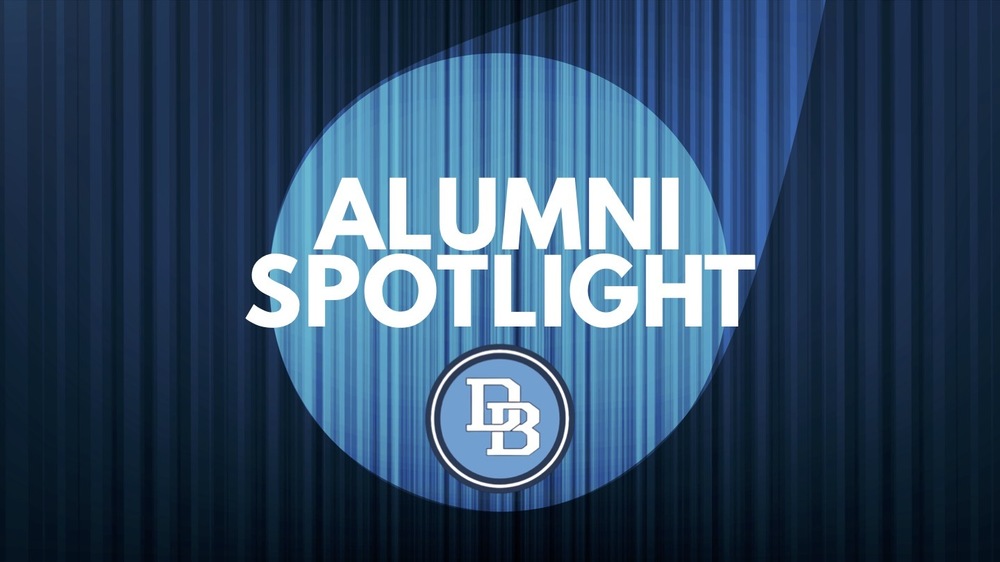 Alumni Spotlight DB logo on a blue stage curtain background with spotlight shining on words.