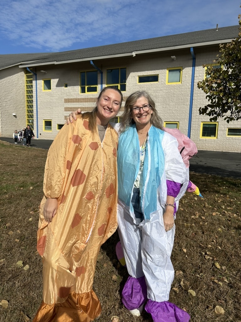 Teachers in inflatable costumes