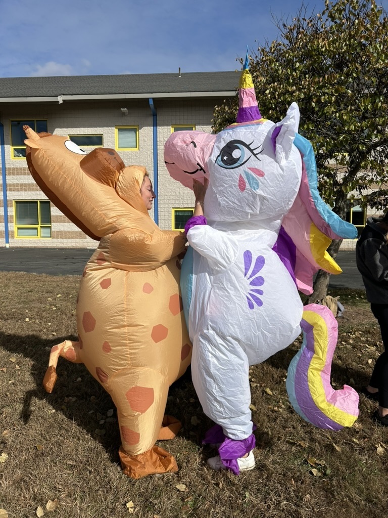 Teachers in inflatable costumes