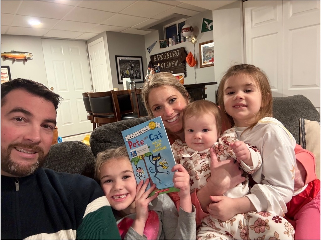 Family reading Pete the Cat book