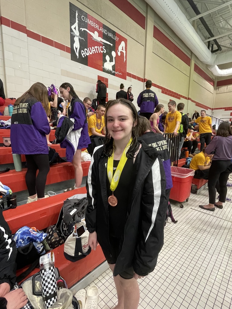 Emily Gaskins wearing her medal