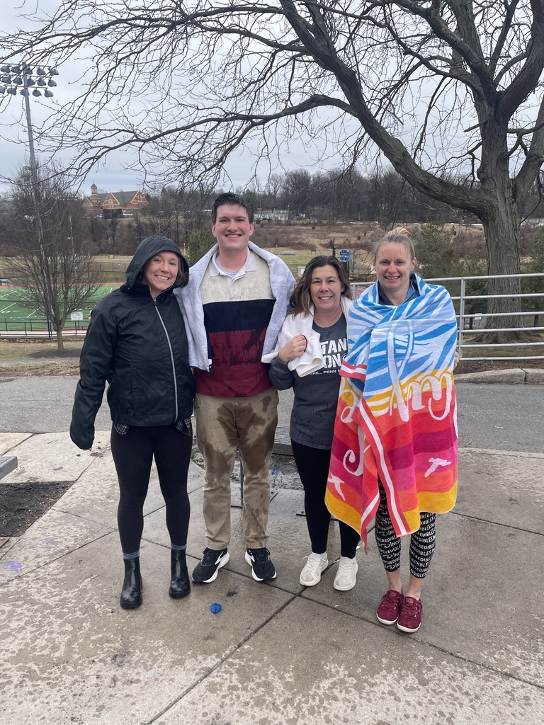 Miss Adams, Mr. Puleo, Mrs. Werner and Ms. Taffel after they were soaked with cold water balloons during a fundraiser for Freezin' for a Reason.