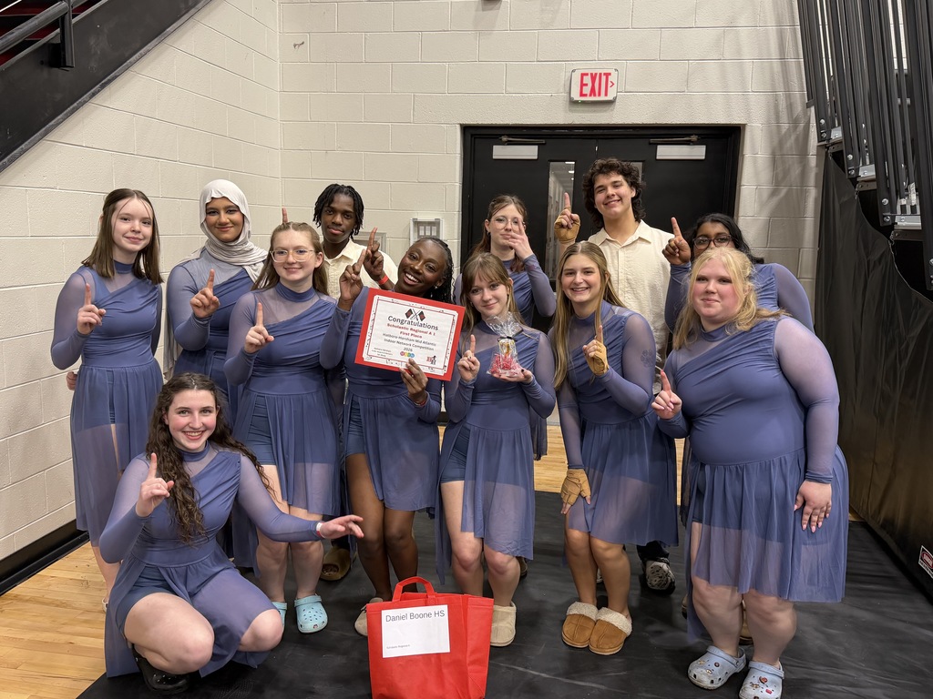 HH Indoor guard posing with their 1st place certificate and holding their fingers in the air representing number 1.