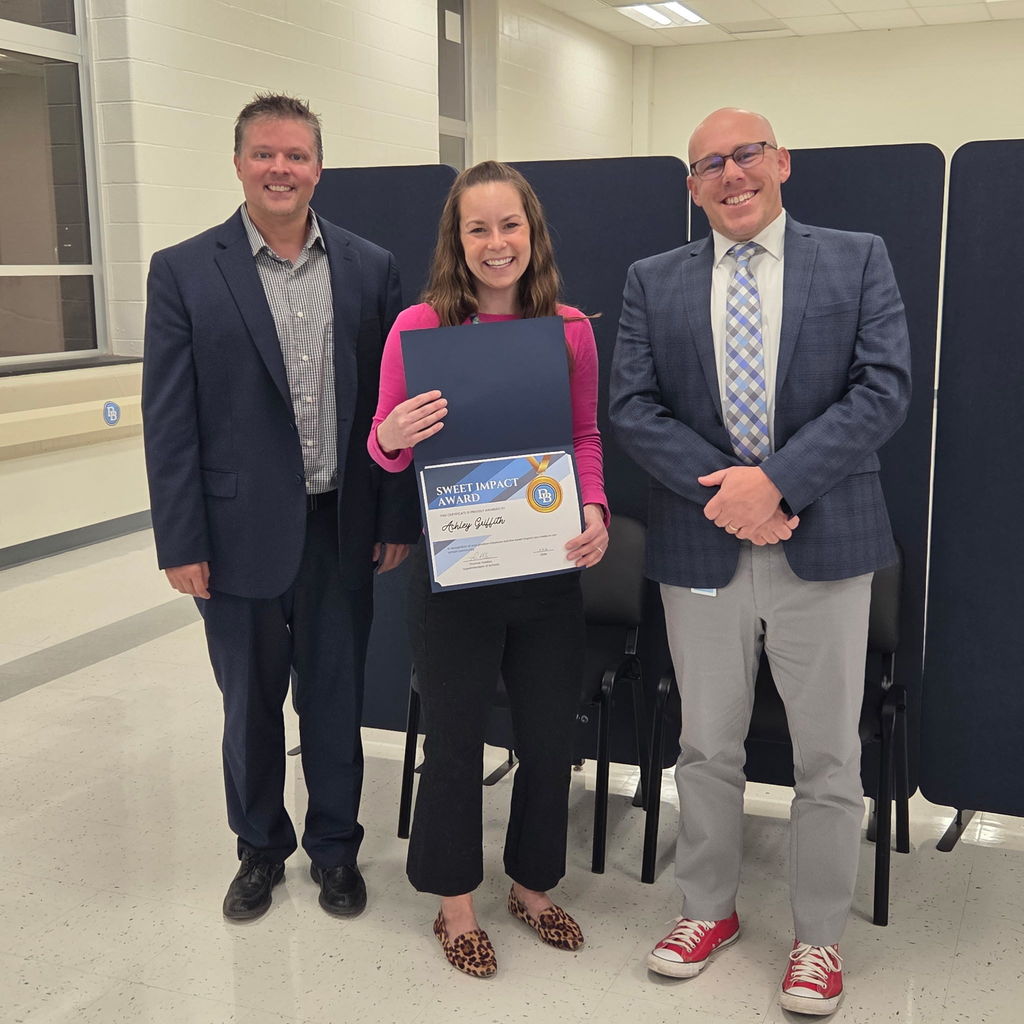 Shane Cross, Ashley Griffith, Tom Voelker with Ashley's Sweet Impact Award Certificate presented at the February  Committee of the Whole meeting.