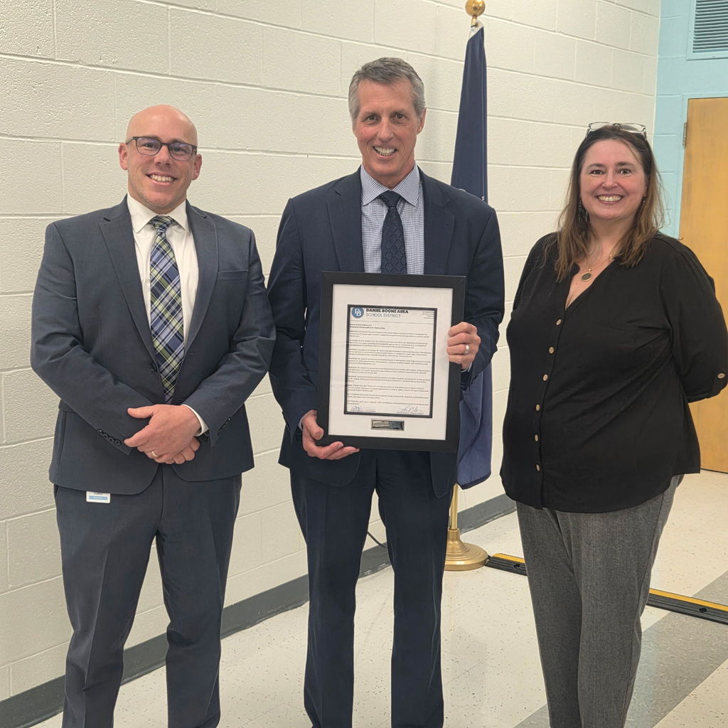 Pictured are Superintendent Tom Voelker, Fox Rothschild Solicitor Brian Subers and School Board Member Julia Olafson. Mr. Subers is holding a framed letter on Daniel Boone School District letterhead thanking him for his service to the district.
