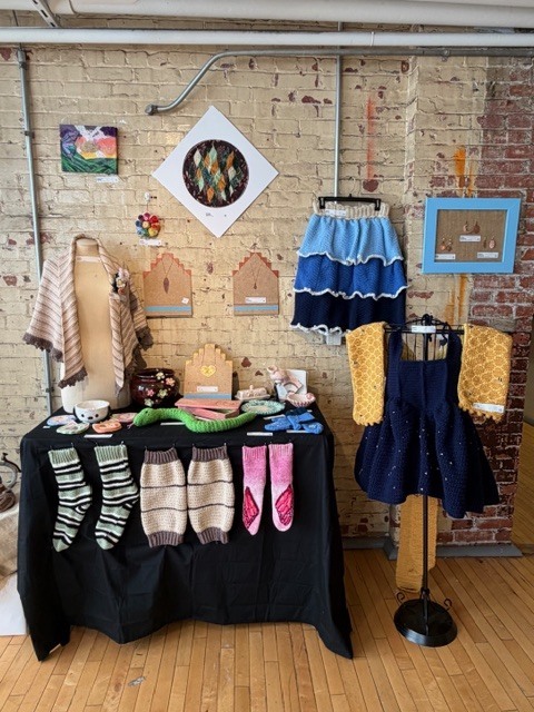 Student knit/crochet work on display