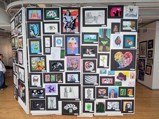 Student drawings displayed on to large panels at the Goggleworks