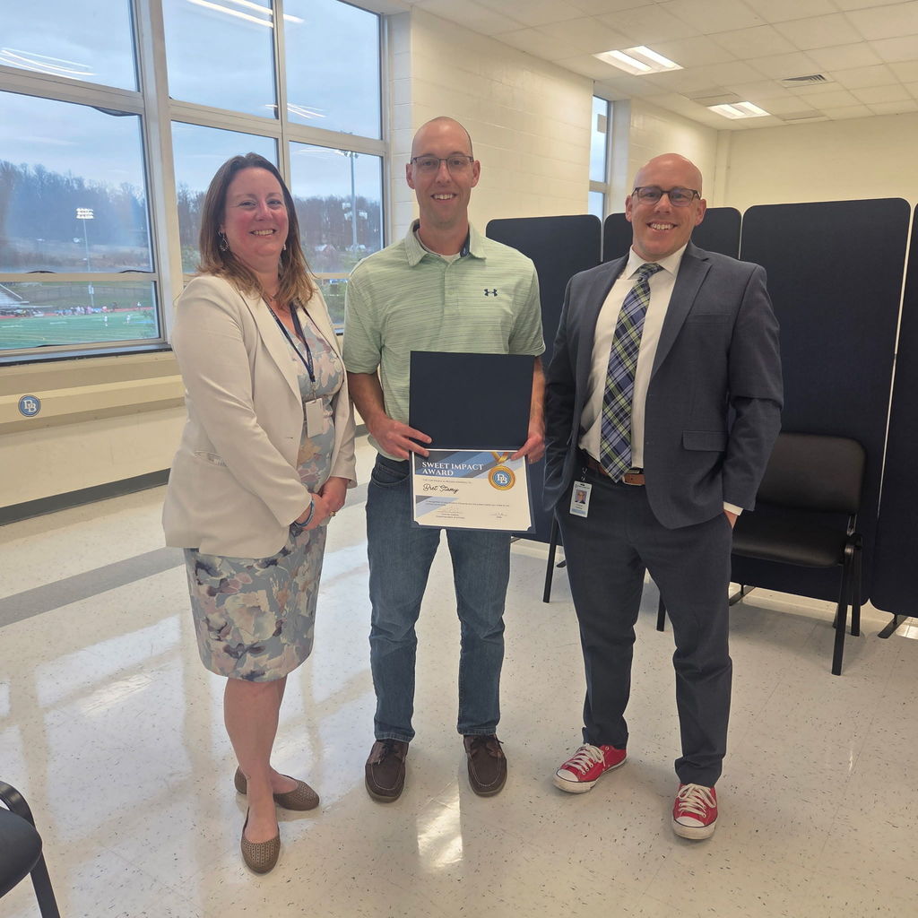 Pictured are Liza Hoppes, Bret Stamy and Tom Voelker. Bret Stamy is holding his Sweet Impact Award certificate.