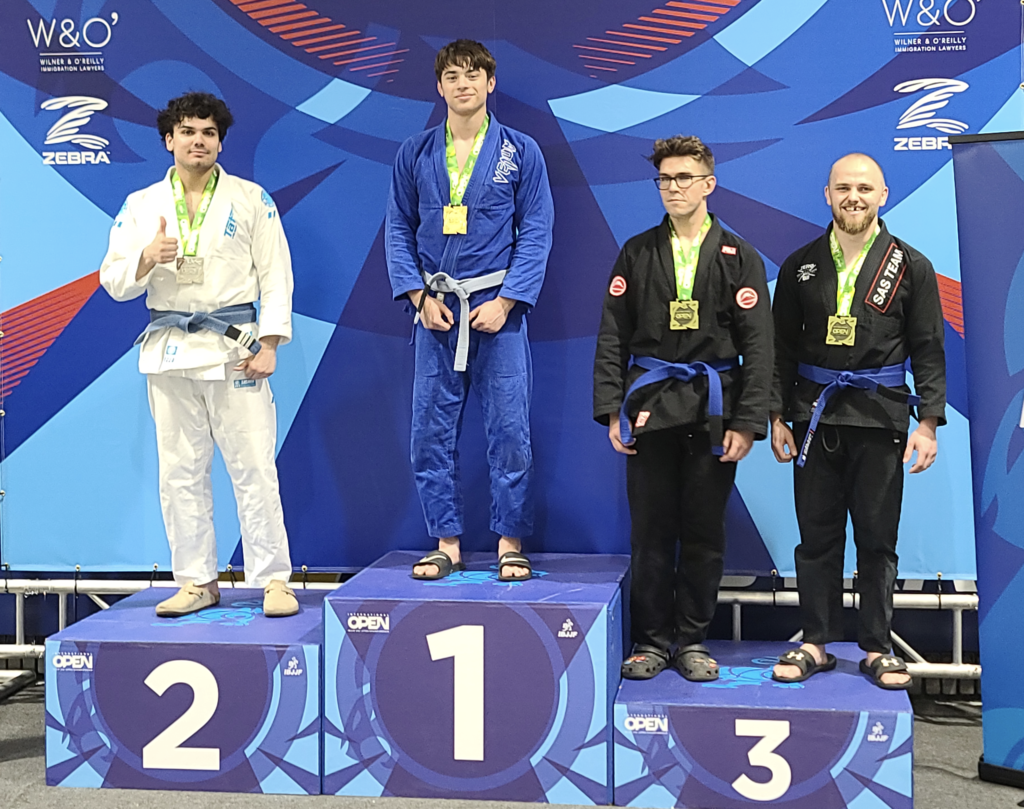 Medal podium 1-3 at the IBJJF New York Open with one first place, one second place and two who tied for third place on the podium